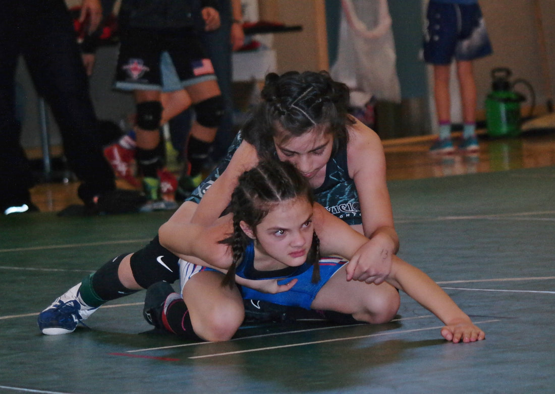 little girl wrestling shoes